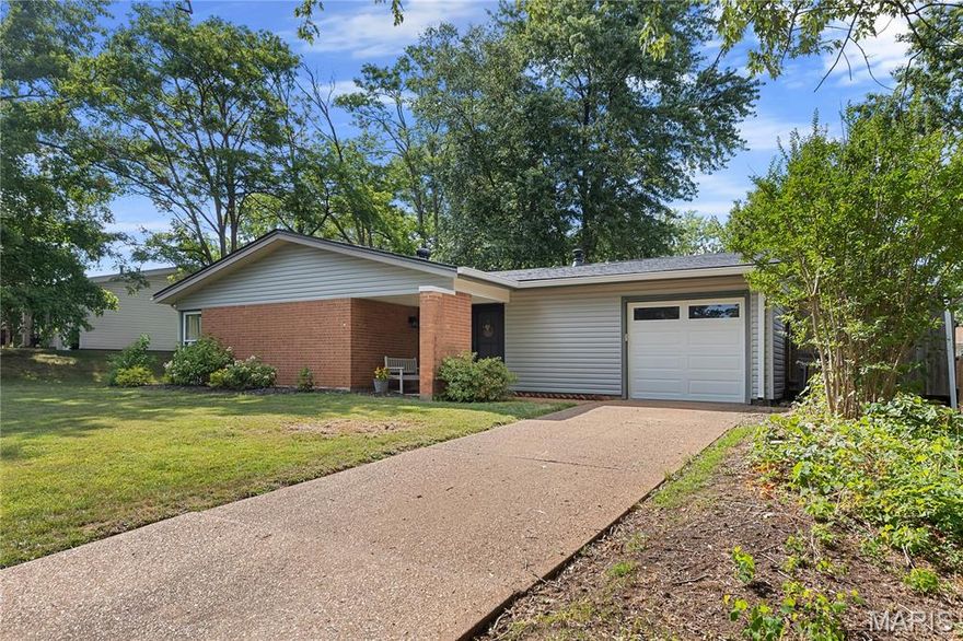 Discover the charm of 701 Chevron Drive, a beautifully maintained ranch-style home in the heart of Mehlville, perfect for families or first-time buyers. This 4-bedroom, 2-bathroom gem offers comfort and convenience in a serene, sought-after neighborhood. Step into a bright, airy living room bathed in natural light from large windows and skylights, creating a warm and inviting ambiance. The open layout seamlessly connects the living area to the dining space and kitchen, which boasts plenty of cabinetry and workspace for cooking and entertaining. The home’s practical design includes four generously sized bedrooms, ideal for relaxation, or hosting guests. Outside, a fenced backyard is perfect for pets, playtime, gardening, or summer gatherings. The property also features a spacious lot and an attached garage for extra storage and functionality. Located just minutes from parks, shopping, and dining, 701 Chevron Drive combines comfort, value, and an unbeatable location. Don’t wait—this move-in-ready home won’t last long! Schedule your visit today!