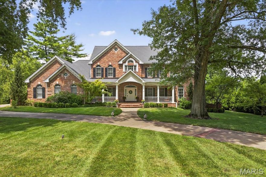 This stunning Frontenac estate offers timeless elegance and resort-style living on nearly an acre. A welcoming brick front porch and circle drive lead into a light-filled interior with high ceilings and wood floors throughout the main level. The two-story living room features dramatic floor-to-ceiling windows with serene views of your own private backyard oasis. The updated chef's kitchen opens to a cozy hearth room, creating the perfect setting for both entertaining and everyday living. The main-floor primary suite boasts dual walk-in closets, a spa inspired bath, and direct views to the expansive back patio overlooking the pool, vibrant landscaping, and the private, wooded backdrop beyond. The finished walkout lower level offers a full wet bar, spacious family room with gorgeous fireplace, two ensuite bedrooms, and seamless access to outdoor living. Extensive storage space and full size LL laundry. Complete with a 4-car garage and exceptional spaces inside and out, this home perfectly blends comfort, sophistication, and privacy.