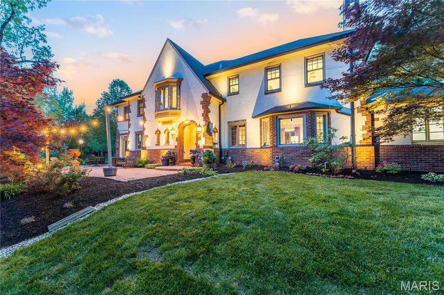 Escape to your private oasis, where a crystal-clear pool invites you to relax, recharge, and revel in outdoor living. Step into timeless elegance in this stunning 1922 Tudor in the coveted Hampton Park neighborhood. This masterpiece features 3 bedrooms, 4.5 baths, plus two bonus rooms—ideal for guest suites or an au pair retreat with full bath and wine cellar in the lower level. Refinished pine floors, stained glass, and rich architectural charm blend with a sophisticated renovation and two-story addition. The eat-in kitchen stuns with a center island, and an upstairs bedroom opens to a private balcony. The luxurious primary suite boasts a dream closet with island and spa-worthy bath with dual vanities, freestanding tub, separate shower, and makeup nook. Each bedroom offers an en suite bath. Enjoy 1.23 acres of lush landscaping, an inground heated pool, multiple decks, a laundry chute, and a wine cellar. Classic character meets modern luxury—refined St. Louis living at its finest. Additional Rooms: Sun Room, Wine Cellar