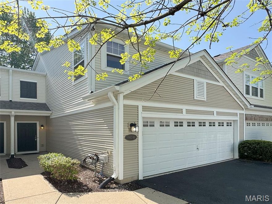 Welcome to this beautiful townhouse offering an exceptional blend of style, comfort, and convenience — complete with a large two-car garage. Thoughtfully updated and impeccably maintained, this move-in ready home showcases a desirable open-concept design enhanced by rich hardwood flooring throughout the main level and BRAND NEW CARPET upstairs. The kitchen is both elegant and functional, featuring crown molding, granite countertops, a center island accented by a hanging culinary rack, and abundant cabinet space. The adjoining breakfast room offers to a sliding glass door that leads to a nice patio and peaceful green space. Upstairs, retreat to the spacious primary suite highlighted by a generous walk-in closet and a private bath complete with an oversized vanity with extended counter space, and a separate water closet for added privacy. A second super-sized bedroom also offers its own large walk-in closet. The upper level is thoughtfully finished with a second full bath featuring an extended vanity and tub. Enjoy the convenience of a smart second-floor laundry room!  Situated on a quiet no-through street in a peaceful neighborhood, this home offers both tranquility and accessibility. A BRAND NEW ROOF in 2025 adds peace of mind. Enjoy low-maintenance living in a prime location with refined updates throughout. Near highway 70, shopping dining, parks, schools, and everything St Charles has to offer. DON'T MISS THIS ONE!