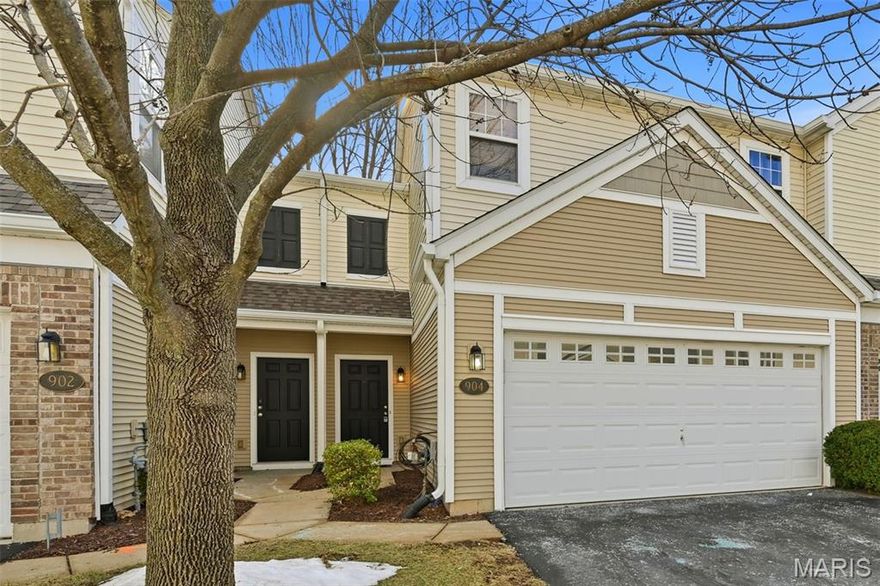 Welcome to this beautiful townhouse offering an exceptional blend of style, comfort, and convenience — complete with a large two-car garage. Thoughtfully updated and impeccably maintained, this move-in ready home showcases a desirable open-concept design enhanced by rich hardwood flooring throughout the main level and BRAND NEW CARPET upstairs. The kitchen is both elegant and functional, featuring crown molding, granite countertops, a center island accented by a hanging culinary rack, and abundant cabinet space. The adjoining breakfast room offers to a sliding glass door that leads to a nice patio and peaceful green space. Upstairs, retreat to the spacious primary suite highlighted by a generous walk-in closet and a private bath complete with an oversized vanity with extended counter space, and a separate water closet for added privacy. A second super-sized bedroom also offers its own large walk-in closet. The upper level is thoughtfully finished with a second full bath featuring an extended vanity and tub. Enjoy the convenience of a smart second-floor laundry room!  Situated on a quiet no-through street in a peaceful neighborhood, this home offers both tranquility and accessibility. A BRAND NEW ROOF in 2025 adds peace of mind. Enjoy low-maintenance living in a prime location with refined updates throughout. Near highway 70, shopping dining, parks, schools, and everything St Charles has to offer. DON'T MISS THIS ONE!