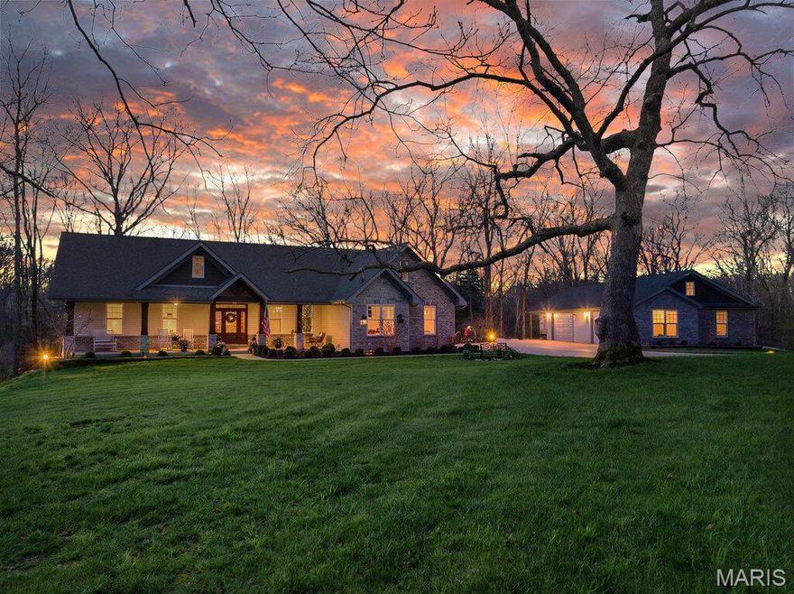 Discover unparalleled luxury and versatility in this custom Craftsman style estate, perfectly situated on a 4.5 acre private and wooded lot.  From the moment you arrive the striking architectural lines and manicured landscaping signal a home of exceptional quality.  The heart of the home is a magnificent open concept great room merging seamlessly with a gourmet kitchen.  Natural light pours through windows flanking a floor to ceiling stone fireplace.  The kitchen itself is a showstopper boasting custom white cabinetry, quartz countertops, stainless steel appliances with double wall ovens, a stylish subway tile backsplash and an expansive center island with storage that is perfect for casual mornings or grand entertaining.  Adjacent to the kitchen is the breakfast room and hearth with coffered ceilings that open directly to a serene screened in porch.  The custom wood built-in shelving in the hearth room surround a  stone propane fireplace.  Don't forget about the home's Formal Dining room with views of the front lawn!  Retreat to the primary suite, a true sanctuary featuring a spa-inspired ensuite and His and Hers walk-in closets.  Indulge in the oversized walk in tile shower, deep soaking tub under a picturesque garden window and massive dual sink vanity with a dedicated makeup station.  Two additional main floor bedrooms, a full and half bath offer comfort and style for family or guests.  The finished walk out lower level doubles your living space featuring a secondary family room with a stone fireplace and built in library style shelving.  A media room, 4th bedroom and full bath can also be found in the lower level.  While here visit the 13x30 workshop that has a full garage door facing the rear of the home that opens to a huge concrete patio.  The thoughtfully designed lower level still allows for ample storage space.  For the hobbyist or car enthusiast the garage space is unmatched.  In addition to the 3 car 23x36 attached garage the estate features a massive detached garage and a covered lean-to.  Complete with a main floor laundry room this estate offers every modern convenience in a tranquil park like setting.