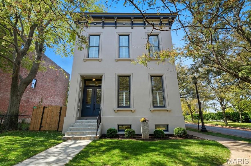 Modern living, modern design in the heart of historic Lafayette Square. This stunning 2021 built, 4bed, 3.5 bath custom home spans 3845 sq ft. Enter to soaring 12-foot ceilings. A truly open floorplan built around a must-see, oversized designer chef’s kitchen. Feature point - a 48” professional Cafe range, surrounded by custom cabinetry reaching 10 feet in height. Quartz countertops, beverage center with built in wine fridge, and high end appliances -- an entertainers dream! Custom office space off kitchen. Neutral, white oak hardwood flooring throughout. In the primary suite, French doors open into a spa like ensuite with soaking tub, custom shower, and dual vanity. Large walk-in closet features custom designed built ins.  A second set of French doors opens to the ensuite balcony. Two additional bedrooms with large closets share large hall bath. Second floor laundry tucked away behind stylish barn doors. Finished basement offers 4th bedroom, full bath, and large family/rec room. Zoned HVAC. Large outdoor patio space with side yard. 26.5’ oversized garage. Just steps away from restaurants, shops, coffee, and Lafayette Park. This home combines modern style, comfort, and walkable urban living on a peaceful tree lined corner lot.