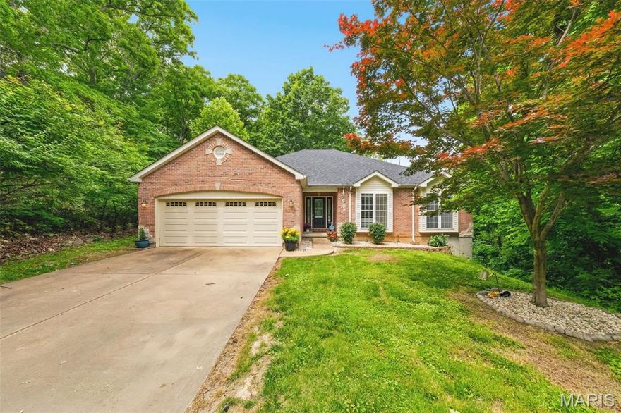 Welcome to this peaceful ranch retreat nestled on approximately 3.18 wooded acres in the highly sought-after Rockwood School District. Surrounded by mature trees and scenic views, this well-loved 3 bedroom, 2.5 bath home offers the perfect blend of privacy, comfort, and everyday functionality. Inside, you’ll find spacious living areas filled with natural light, a large eat-in kitchen with plenty of cabinet space, and a warm, inviting family room with tall ceilings and an abundance of windows looking out at the stunning backyard view of the wooded, rolling hills. The primary suite features a coffered ceiling, bay windows, and its own private bath with double vanities, jetted tub & separate shower, while the additional bedrooms provide generous space for family or guests. The walkout lower level is more than a basement, but an extension of living space with the many egress windows, half bath and french doors. Step outside and enjoy the beauty of nature from the patio while gardening or the expansive side deck overlooking the peaceful wooded setting. Updates include a new roof (2024), new HVAC (2020), new drain field (2017), all new carpet (2026), new kitchen dishwasher & refrigerator, new laminate flooring in lower level (2026), and a new water softener (2025). With a walk-out lower level, oversized garage, and room to make it your own, this property is ideal for anyone looking for quiet country-style living with the convenience of nearby amenities, shopping, and top-rated schools.