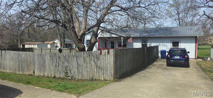 Comfortable 3-bedroom, 1.5-bath single-level home conveniently located on a corner lot right in town! Home has durable metal siding and a metal roof providing long-lasting, low-maintenance living, while major updates—including a new HVAC system with central air and a hot water heater installed in 2022—offer peace of mind.
The kitchen comes fully equipped with appliances that stay, making move-in easy. A bonus room in the converted garage adds flexible space perfect for a home office, hobby room, playroom, or extra living area.  Privacy fenced yard, situated on a corner lot.
Best of all, you’ll love the convenient location near schools, shopping, the city park, and the community pool—everything you need just minutes away!

Don’t miss this great opportunity to own a comfortable, well-maintained home in a fantastic in-town location.