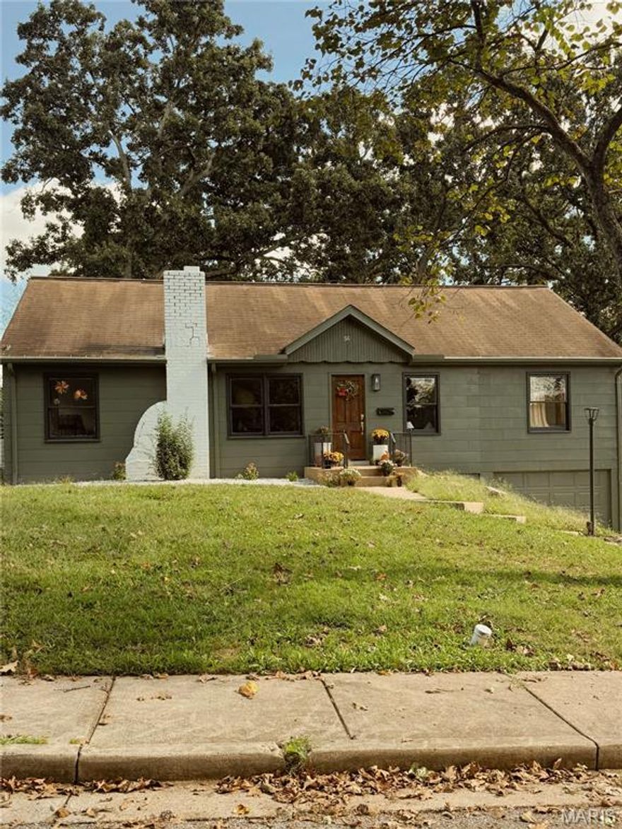 Welcome home to this beautifully updated 3-bedroom, 2-bathroom gem in the heart of Rolla! This stunning move-in ready home blends original charm and modern updates throughout. Step inside to a cozy living room boasting wood flooring that flows seamlessly into the dining area, creating an inviting space perfect for both everyday living and entertaining. The beautifully designed kitchen is sure to impress with rich green cabinetry, butcher block countertops, a center island, and a convenient pantry for additional storage. The primary suite is truly a showstopper and offers a private retreat within the home. The serene suite features a walk-in closet and an incredible ensuite bathroom complete with a double vanity, classic free-standing clawfoot tub, and a separate shower for a spa-like experience. Two additional bedrooms and a full guest bathroom provide comfortable accommodations, while the centrally located hallway laundry adds everyday convenience. The home sits on a full unfinished basement offering abundant storage and includes a tuck-under garage. This stunning, thoughtfully updated home is ready for its next owner—schedule your private showing today!