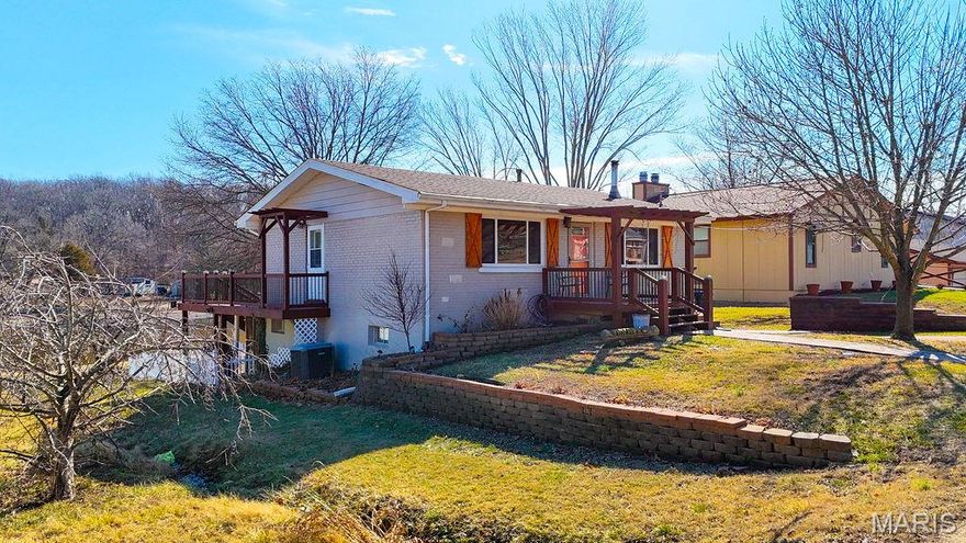 Waterfront Living at Its Best! Nestled on a peaceful lakefront lot, this well-maintained, all brick ranch home offers year-round views, private dock access, and a setting that feels like a retreat while still being close to town. Enjoy morning coffee and stunning sunsets overlooking the water, with frequent wildlife sightings adding to the tranquil atmosphere.
The home features a bright, functional layout with an updated kitchen, comfortable living spaces, and a fully finished walk-out lower level that expands your living and entertaining options. Recent updates throughout the years reflect pride of ownership, including a remodeled bathroom, updated flooring, newer appliances, and a finished lower level with kitchenette—ideal for guests, hobbies, or relaxing after a day on the lake. Outdoor living truly shines here with multiple decks, a screened-in patio area, private dock, fenced yard, and mature trees providing shade and privacy. Whether fishing, kayaking, or simply enjoying the peaceful water views, this property delivers the lake lifestyle so many buyers are seeking. A storage shed, generator, and extensive landscaping add convenience and value. Located in a gated lake community, this property offers a rare combination of waterfront access, outdoor living, and long-term care and improvements. A unique opportunity to own a thoughtfully updated lakefront home. An additional lot is also available. For more information, contact listing agent.