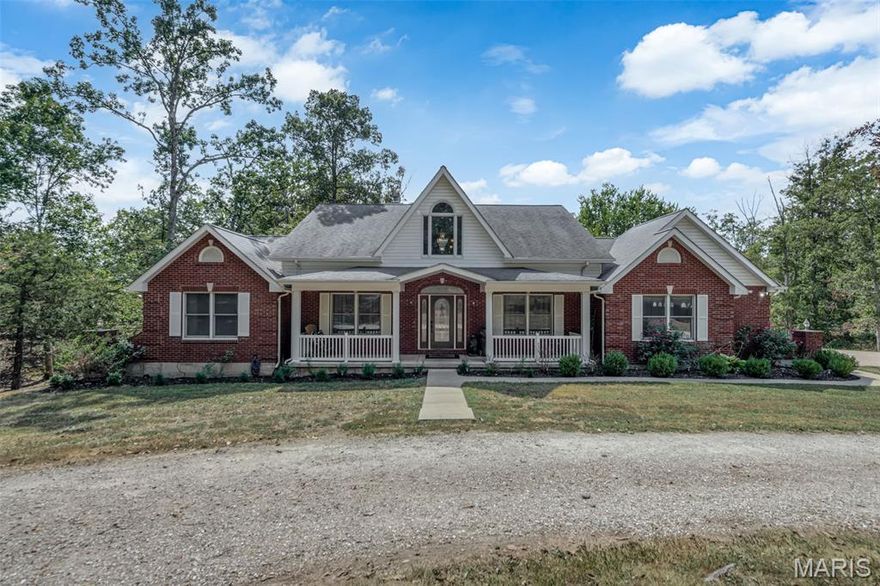 WOW ESTATE LIVING AT ITS BEST! CHECK OUT THE NEW PRICE! Deer and wildlife love the beautiful lake ( don't forget to check out the last photo of the fish caught in the lake, fish and hunt at your leisure.   Gorgeous 1.5 story home on 11.35 gorgeous acres with a 2.5 acre stocked lake with large bass and crappie. Enjoy coffee in the morning in front of the beautiful fireplace in the updated kitchen or relax in the Main floor master, solid wood interior doors, 2 new kitchens including a main floor kitchen with stainless steel appliances including an air fryer oven, solid surface counters, wood burning fireplace and center island with a breakfast bar, separate dining room. New full kitchen in the lower level with all new appliances. Entering the front of the home there is a large covered porch, 2 story entry, large living room, beautiful wood floors, open stairway to the upper level, your main level primary suite with a sitting area, 2 walk in closets and a gorgeous bath with whirlpool tub and separate shower. Upstairs you will find 2 additional bedrooms with a jack and jill bath, a balcony overlooking the entry and living area. Walk downstairs and you will find an amazing professionally finished family room, full bath, a second new kitchen and sun room with a full wall of windows. Outside you will find a large deck with composite decking overlooking the beautiful lake stocked with large bass and crappie.  This home has a possibility of a 4th bedroom on the main level. New geothermal HVAC system, a new septic system, new water heater and is also equipped with a central vac system and new water softener. There is plenty of parking in the oversized 3 car garage with lots of storage area and mud room with a toilet and a huge circle driveway for additional parking.  This home has been lovingly cared for and move in ready! Approximately 7 miles to interstate I-70 for commuting!