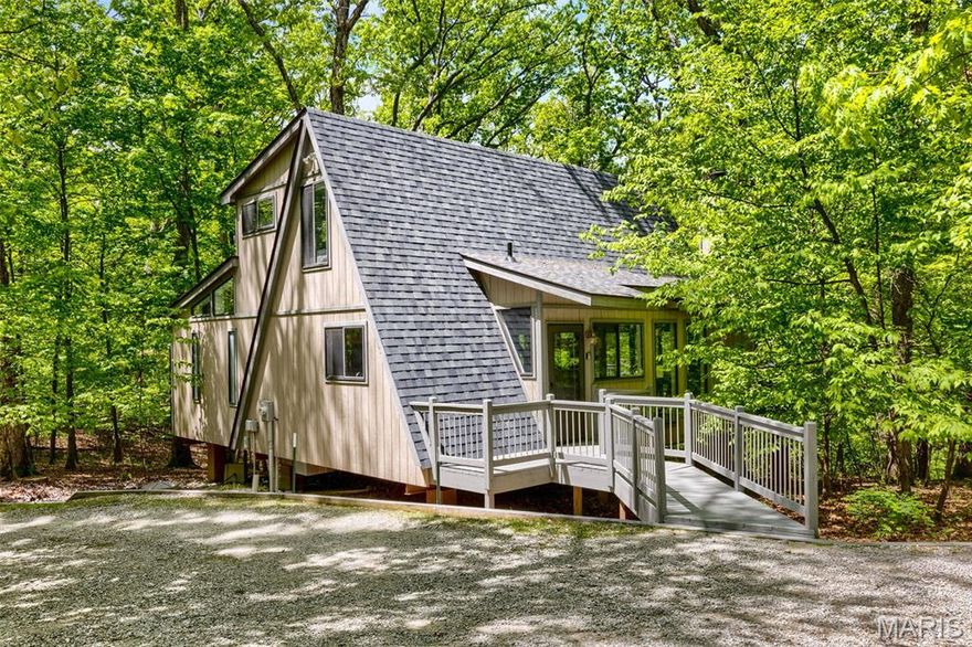 Not your typical Innsbrook chalet—this architect-designed retreat delivers a clean, modern aesthetic with a true “NYC in the woods” feel. Thoughtfully reimagined and completely turnkey (everything included), it’s a refined escape for those who want the setting of Innsbrook without the traditional rustic style. The open-concept great room blends living, dining, and kitchen spaces with dramatic walls of glass and a striking fireplace, bringing in natural light and framing the surrounding trees. The updated kitchen features modern cabinetry, stainless appliances, and a layout designed for both everyday use and effortless entertaining. The main-floor primary suite offers a true spa-like experience, with an expanded bath featuring dual vanities (two separate sink areas), a walk-in shower, and a whirlpool tub. A main-floor laundry adds convenience. Upstairs, a versatile loft provides additional space for guests, a home office, media lounge, or a private yoga/meditation retreat. Outdoor living is equally compelling, with a screened porch and deck that feel fully immersed in the woods—private, peaceful, and connected to nature. With strong rental potential and a design-forward approach rarely found at Innsbrook, this is a rare opportunity to own a move-in ready retreat that stands apart. Brand new roof installed April 2026.
