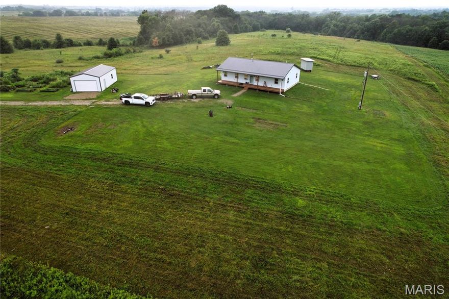 This 26-acre tract in Browning, Missouri offers the perfect blend of country living and recreational opportunity. The property features a 3-bedroom, 2-bathroom home with a bonus room perfect for an office or play room. Home features a durable metal roof, cozy wood stove heat & is also wired for mini split to supplement heat and air conditioning if desired. A nice detached garage provides ample space for vehicles or storage.

The land is fenced on three sides and includes a mix of pasture and timber, ideal for both livestock and wildlife. A small creek winds through the property, adding natural beauty and drawing in game. Located in a region known for big deer and abundant turkeys, this is a prime setup for hunters or outdoor enthusiasts.

Whether you’re looking for a peaceful place to call home or a weekend hunting retreat, this property checks all the boxes.

**School District is Linn County R1**