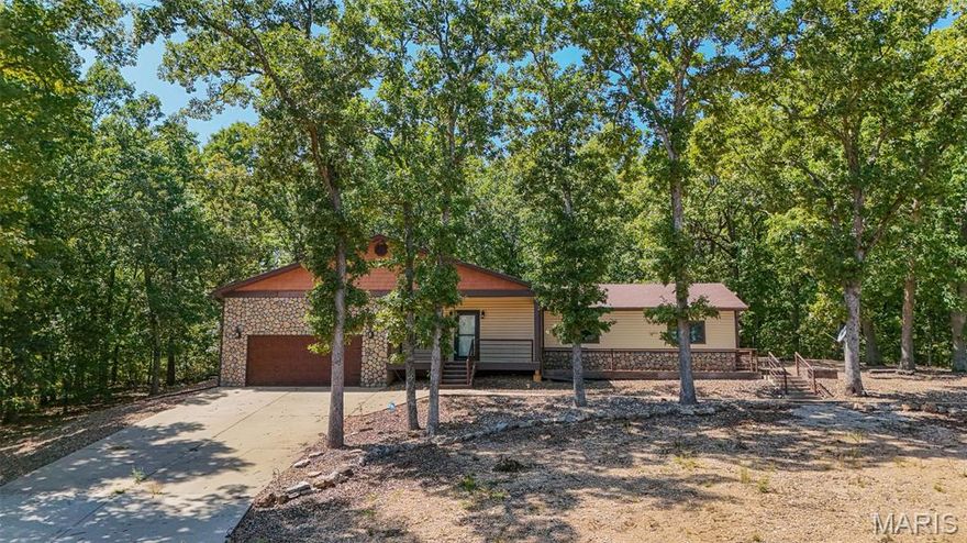 Beautiful 4-bedroom, 3-bathroom home with a separate 1-bedroom, 1-bathroom apartment/guest house—perfect for extended family, visitors, or potential rental income! The perfect blend of craftsmanship and comfort awaits on over 11 acres in Richland. Inside, you’ll love the scraped wood-engineered flooring, spacious open concept layout,  stylish tile, rustic accents, and gleaming granite countertops. Gather around the cozy fireplace in the living room or take in breathtaking views from the expansive porch and deck. This property also includes a versatile 24’ x 24’ garage/workshop building with an overhead door, metal siding and roof, concrete floor, and loft area. For added convenience, the garage features a wheelchair lift. All of this just 23 miles from Osage Beach—offering both peace and accessibility. A must-see property that combines beauty, functionality, and opportunity! Schedule your private tour today!