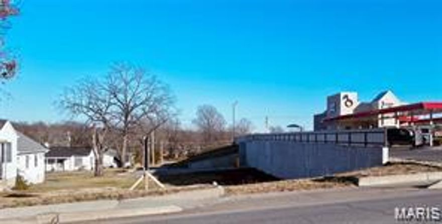 Great opportunity to have 120 feet of Highway  63 (Bishop Ave.) frontage! Just under half an acre with 2 rental houses. One is rented on a month to month for $460. per mo. Sits next door to Sonic, just a block from the Highway 63 & Highway 72 intersection.