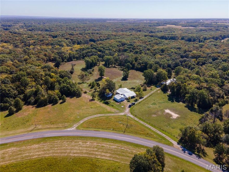 This stunning 5-bed, 2.5-bath ranch house on 120 fully fenced acres in Clark County, MO, is the perfect blend of comfort and nature. The 3,000 sq. ft. home features spacious living areas, finished walk out basement with egress, a 2-car attached garage, and a covered wrap-around porch offering scenic views. With 17 acres of pasture, a 2.5-acre pond, and a 1.5-acre pond, this property is ideal for farming, fishing, and relaxing. Wildlife enthusiasts will love the abundant deer and turkey, while the 3,000 sq. ft. shop provides ample space for projects or storage. Escape to tranquility and make this nature-lover’s paradise yours!