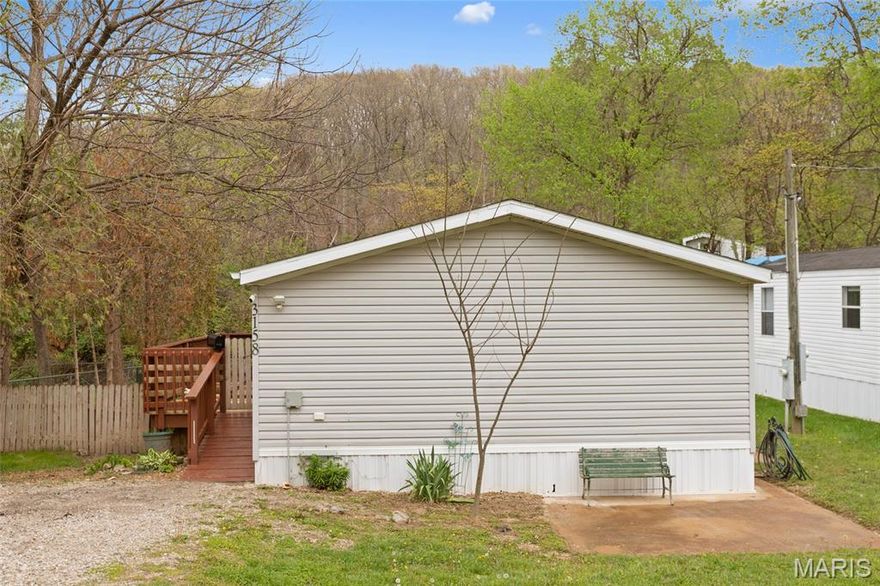 Move in ready.  If you are looking for a quiet place to call home look no further. Dead end street. Not much traffic. Slow country living at its finest while still 10 minutes to civilization. This home has had quite a few updates. Newer windows. newer flooring and new carpet in bedroom.  Come and check it out today. Rent in the area would be almost double of what the payment for this home will be.