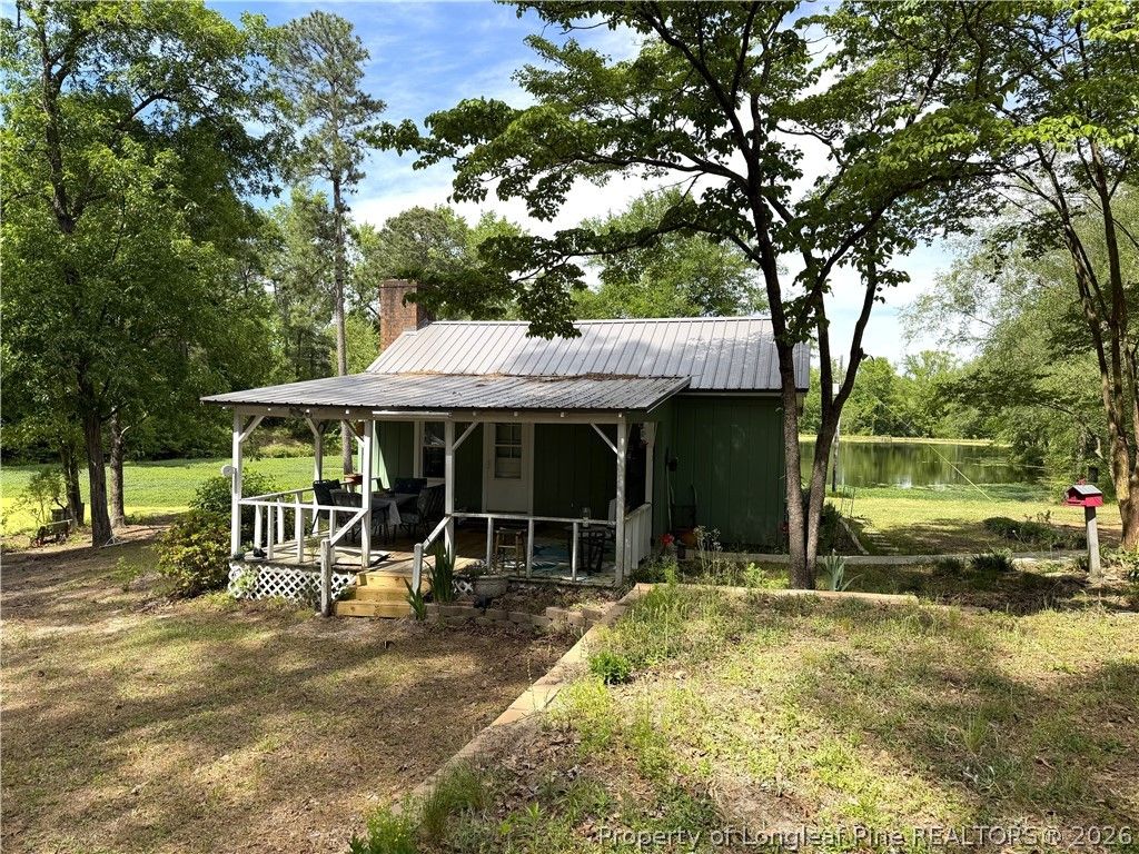 Photo of 132 &amp; 14 Strickland Cabin Lane, Salemburg, NC 28385 (MLS # 761391)