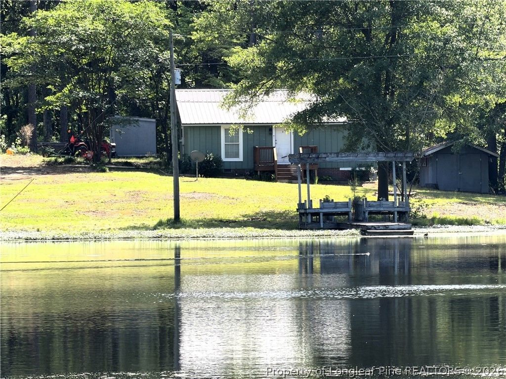 Photo of 132 &amp; 14 Strickland Cabin Lane, Salemburg, NC 28385 (MLS # 761391)