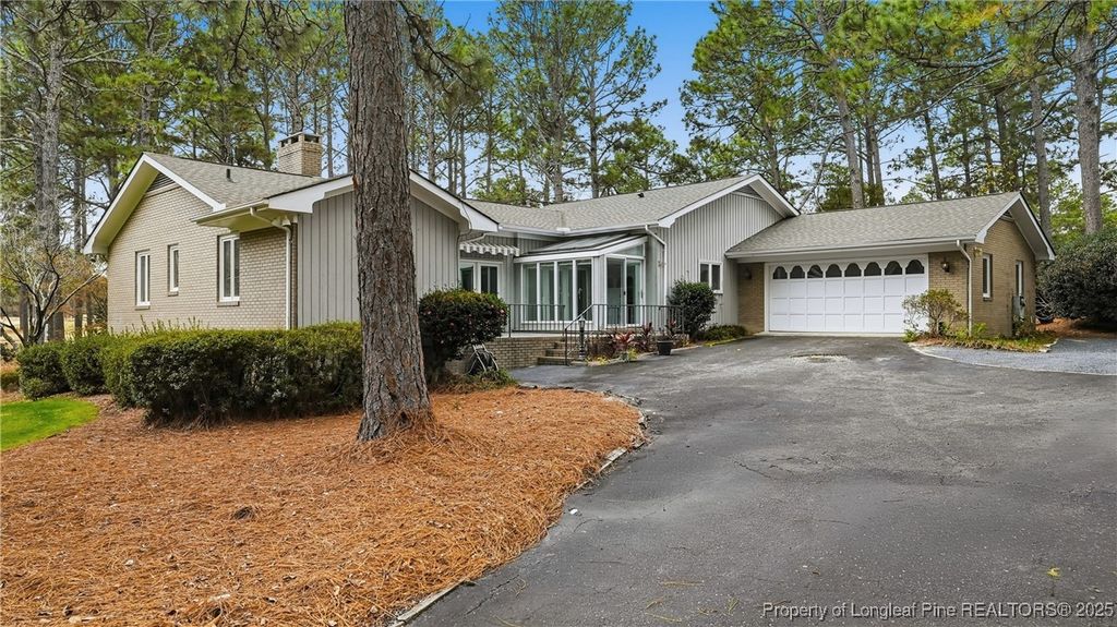 Photo of 1 Country Club Boulevard, Whispering Pines, NC 28327 (MLS # 753973)
