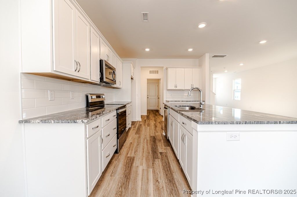 Photo of 4531 Bunkers Bay Lane, Hope Mills, NC 28371 (MLS # 750097)