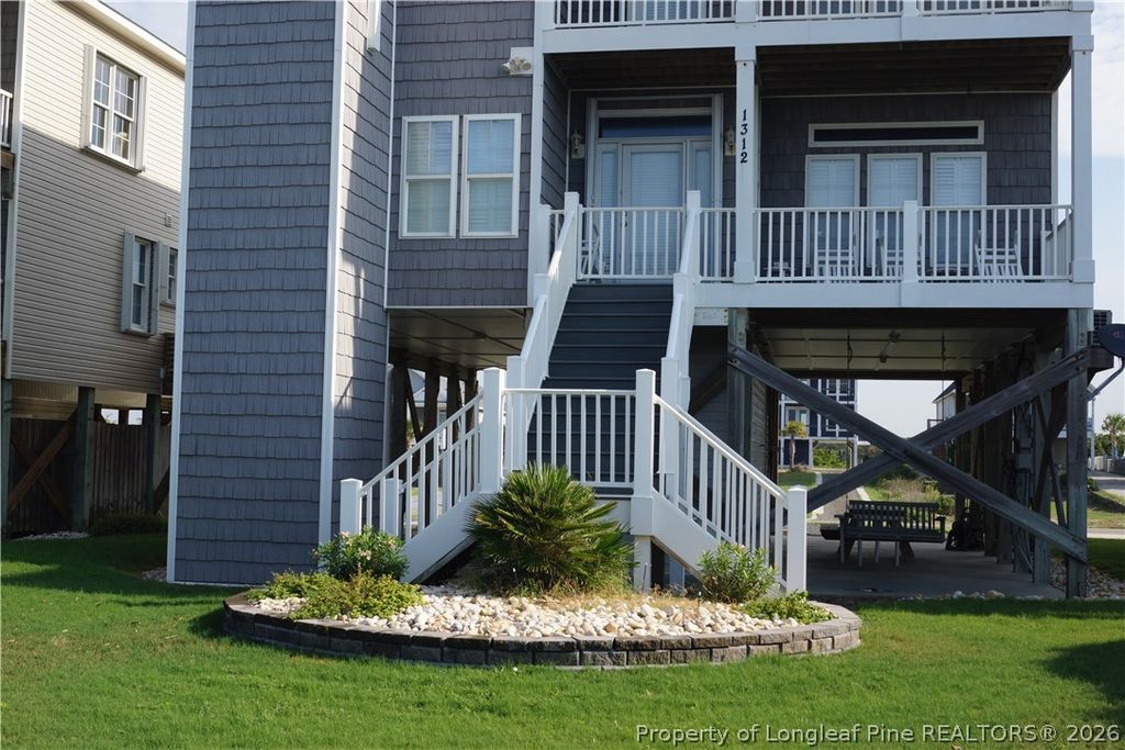 Photo of 1312 W BEACH DR, Oak Island, NC 28465 (MLS # 765861)