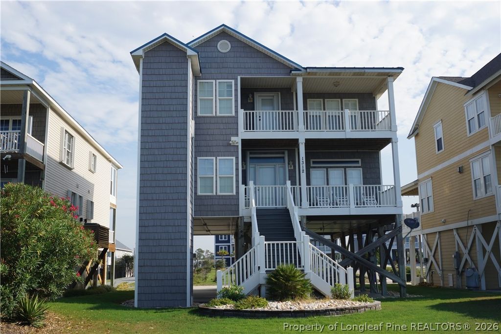Photo of 1312 W BEACH DR, Oak Island, NC 28465 (MLS # 765861)