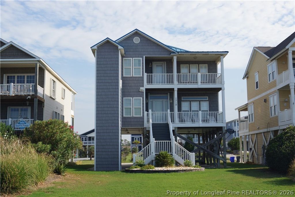 Photo of 1312 W BEACH DR, Oak Island, NC 28465 (MLS # 765861)