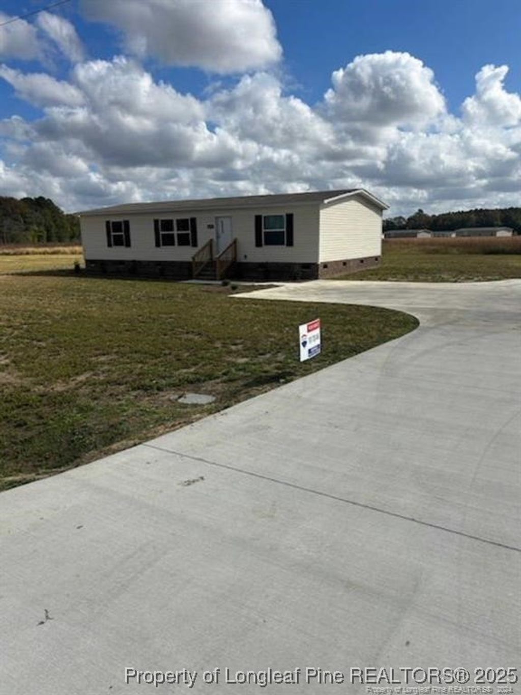 Photo of 4076 Meadow Road N, Lumberton, NC 28358 (MLS # 752941)