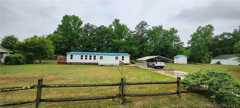 Photo of 128 & 124 Skip A Rock Lane, Hope Mills, NC 28348 (MLS # 761464)