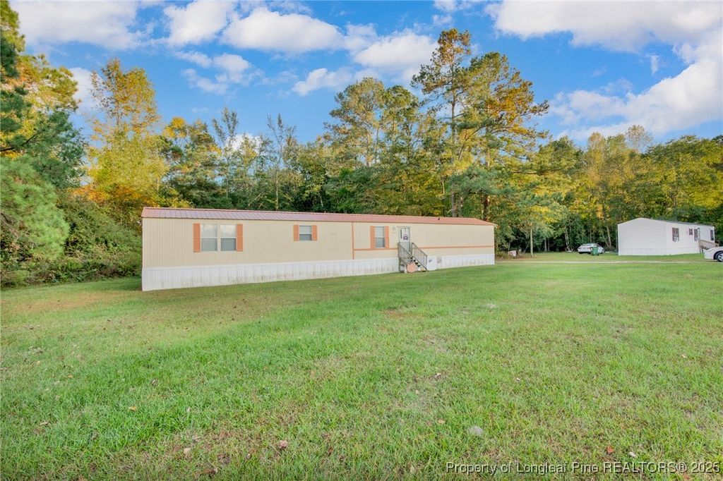 Photo of 6461 Wiregrass Road, Orrum, NC 28369 (MLS # 752000)