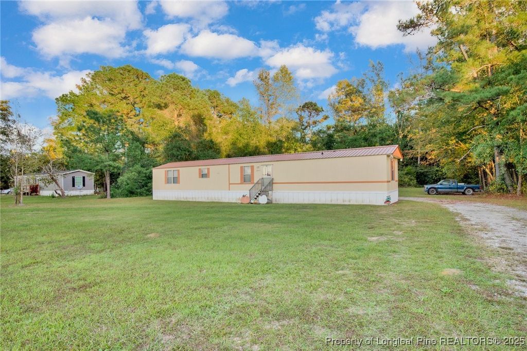 Photo of 6461 Wiregrass Road, Orrum, NC 28369 (MLS # 752000)