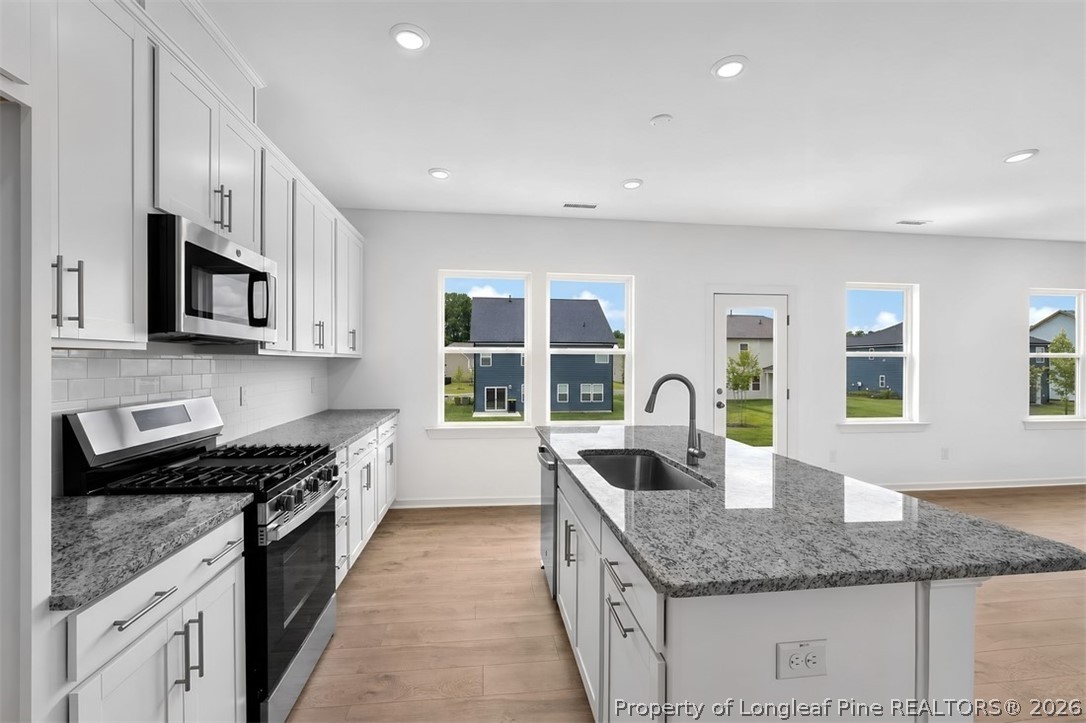 Second Floor Plan - Additional Highlights Include: a main floor bedroom with a full bathroom, additional windows in the great room, an expansive shower in the primary bathroom, and a dual sink vanity in the secondary bathroom