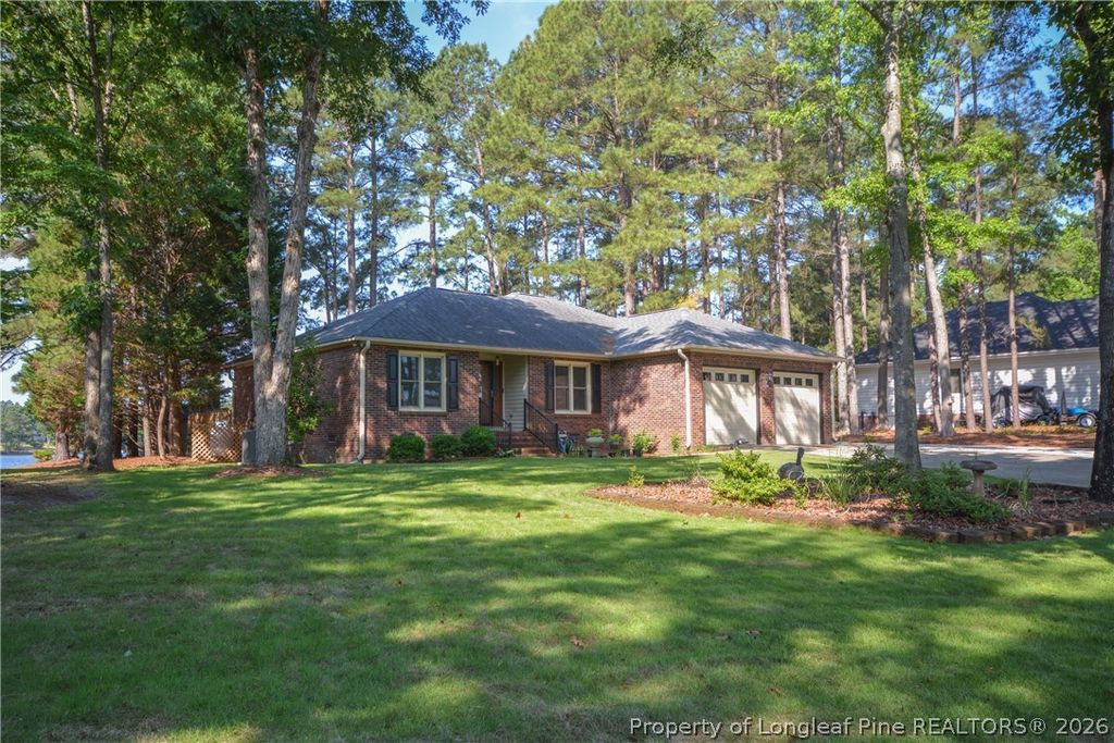 Photo of 18 Sandy Point, Sanford, NC 27332 (MLS # 762828)