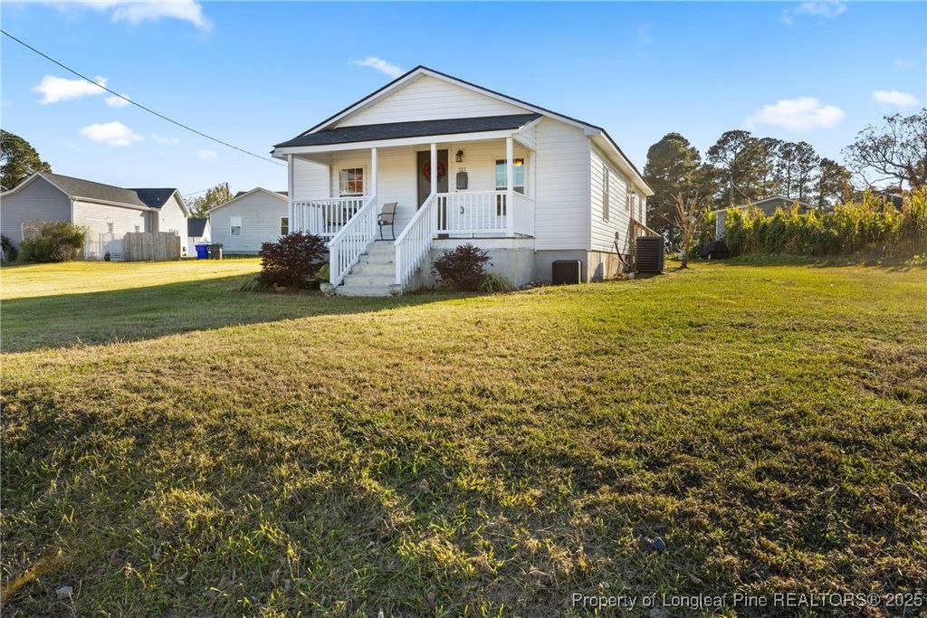Photo of 303 W Martin Street, Benson, NC 27504 (MLS # 753014)