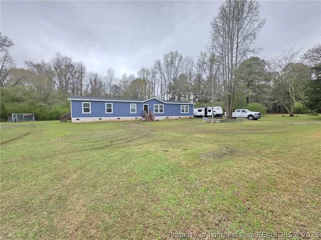Photo of 64 Horseshoe Road, Autryville, NC 28318 (MLS # 759012)