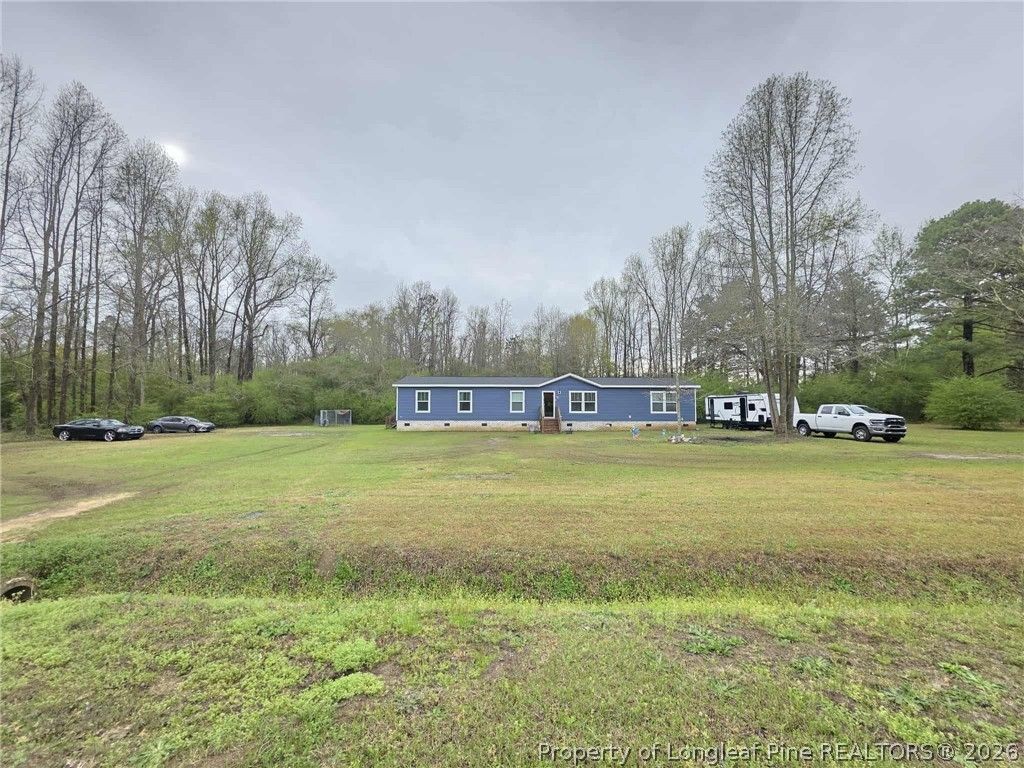 Photo of 64 Horseshoe Road, Autryville, NC 28318 (MLS # 759012)