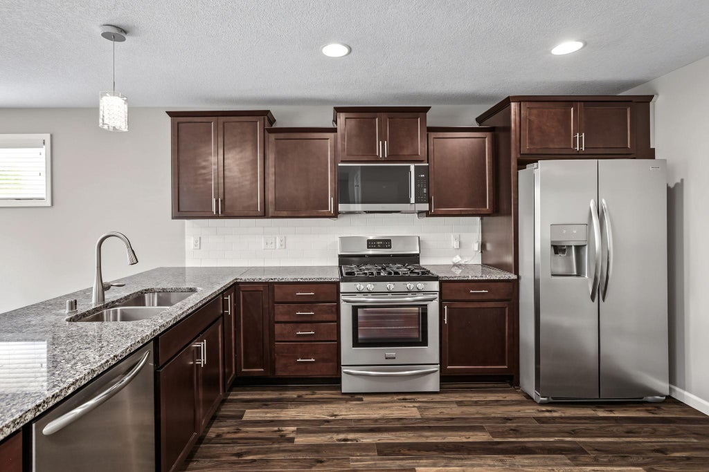 Photo of 9415 Toledo Lane N, Brooklyn Park, MN 55443 (MLS # 7117148)