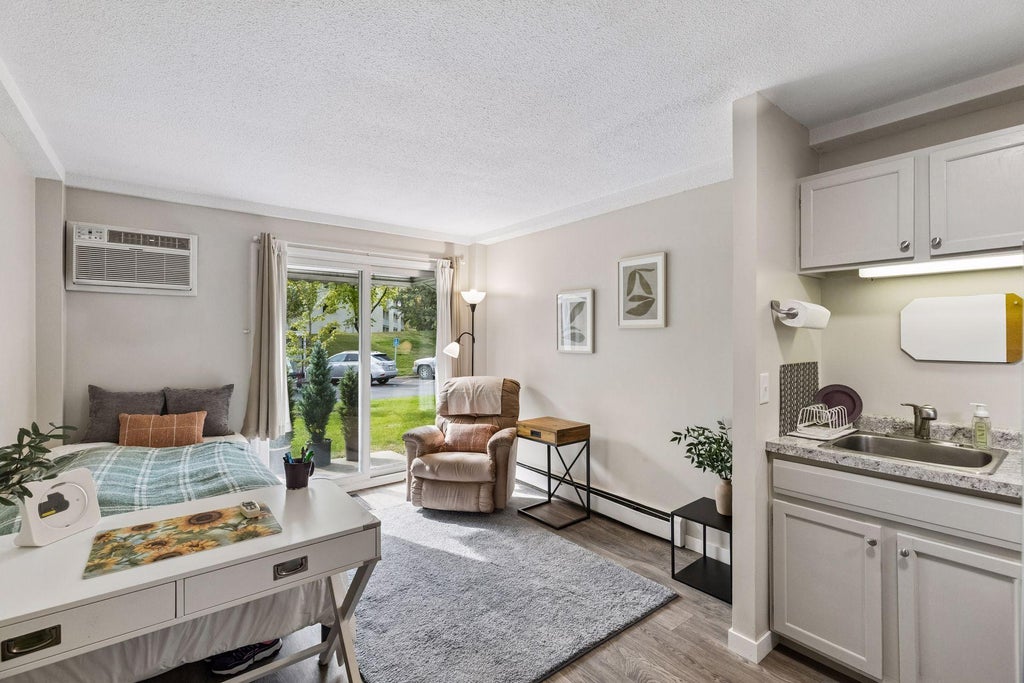 Photo of 130 Demont Avenue E #144, Little Canada, MN 55117 (MLS # 7156365)