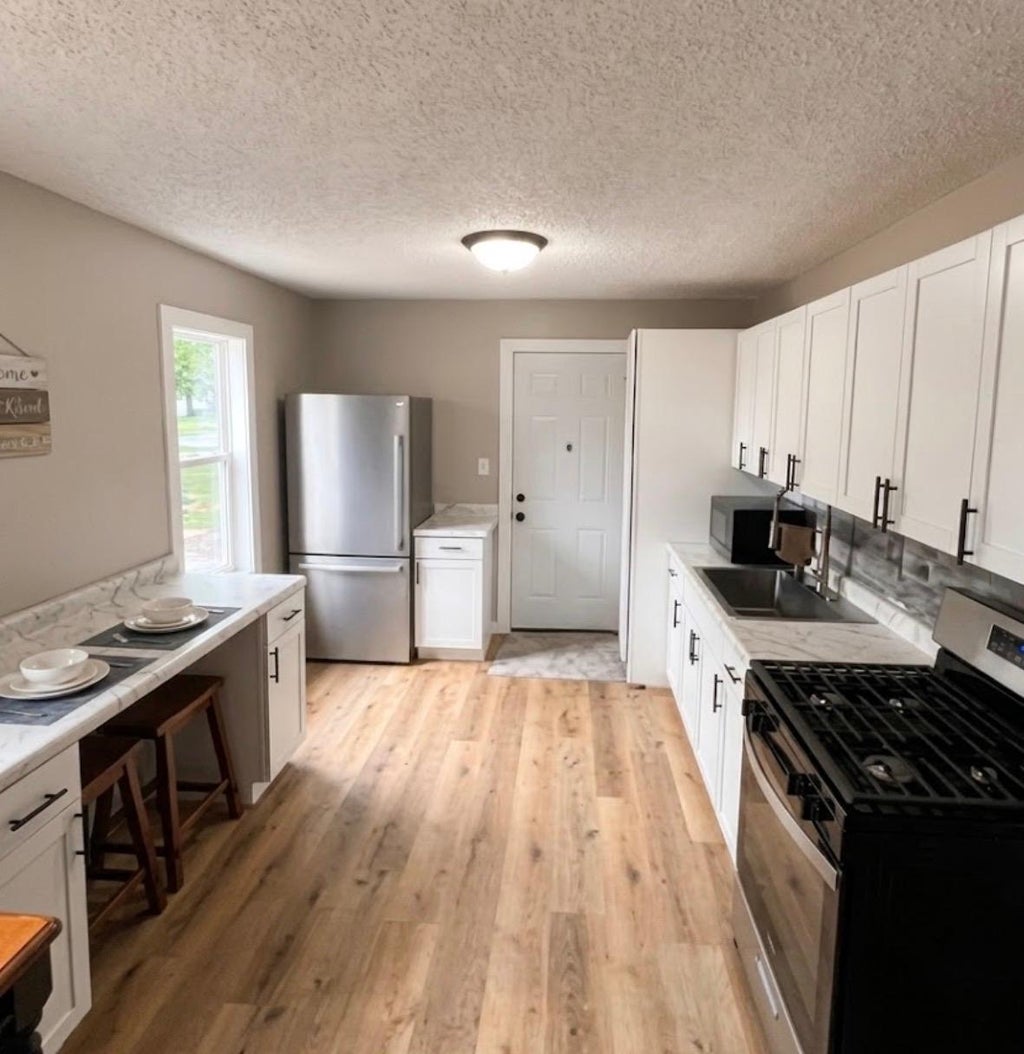 Photo of 10901 4th Street NE, Blaine, MN 55434 (MLS # 7131172)