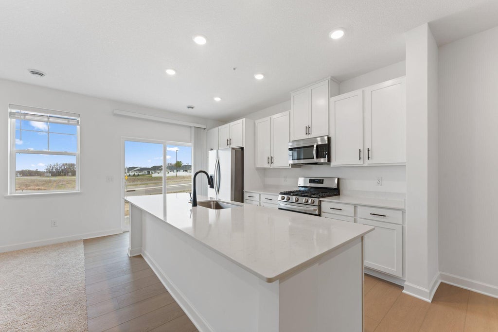 Photo of 10558 Glacier Lane N, Maple Grove, MN 55369 (MLS # 7097880)