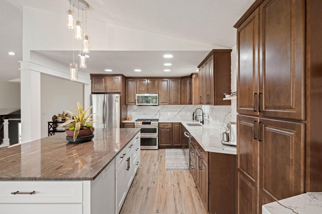 Photo of 7712 N College Park Drive, Brooklyn Park, MN 55445 (MLS # 7140547)