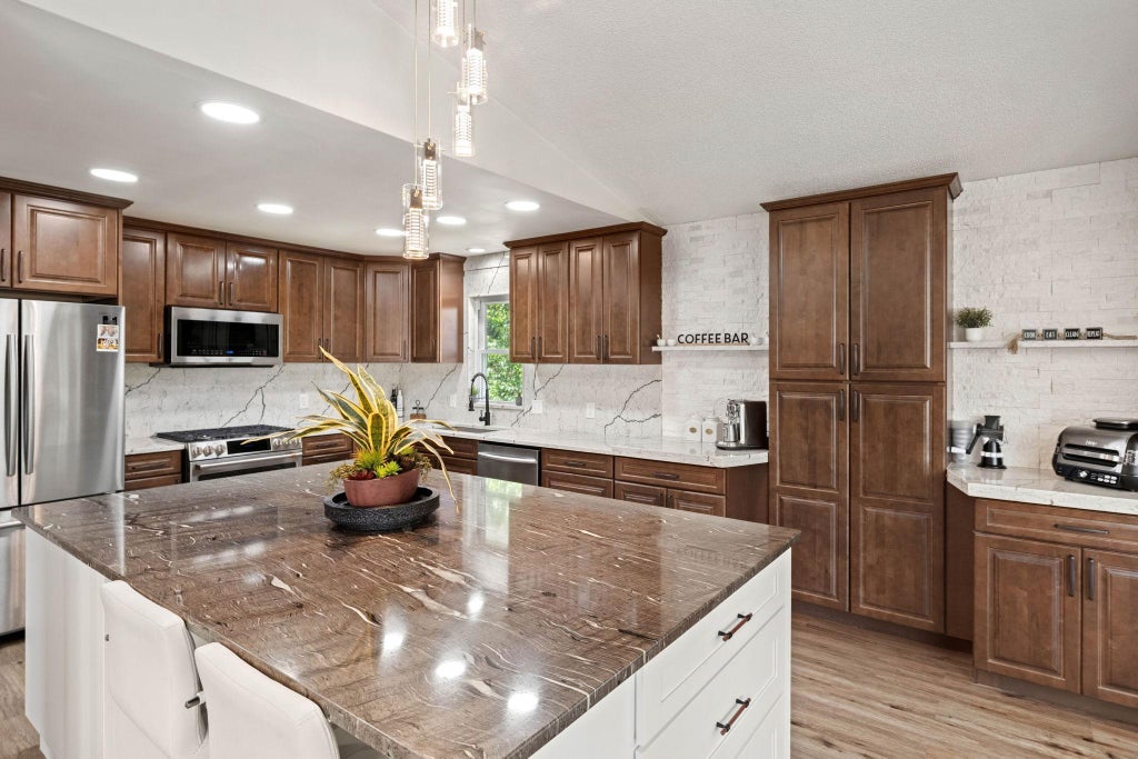 Photo of 7712 N College Park Drive, Brooklyn Park, MN 55445 (MLS # 7140547)