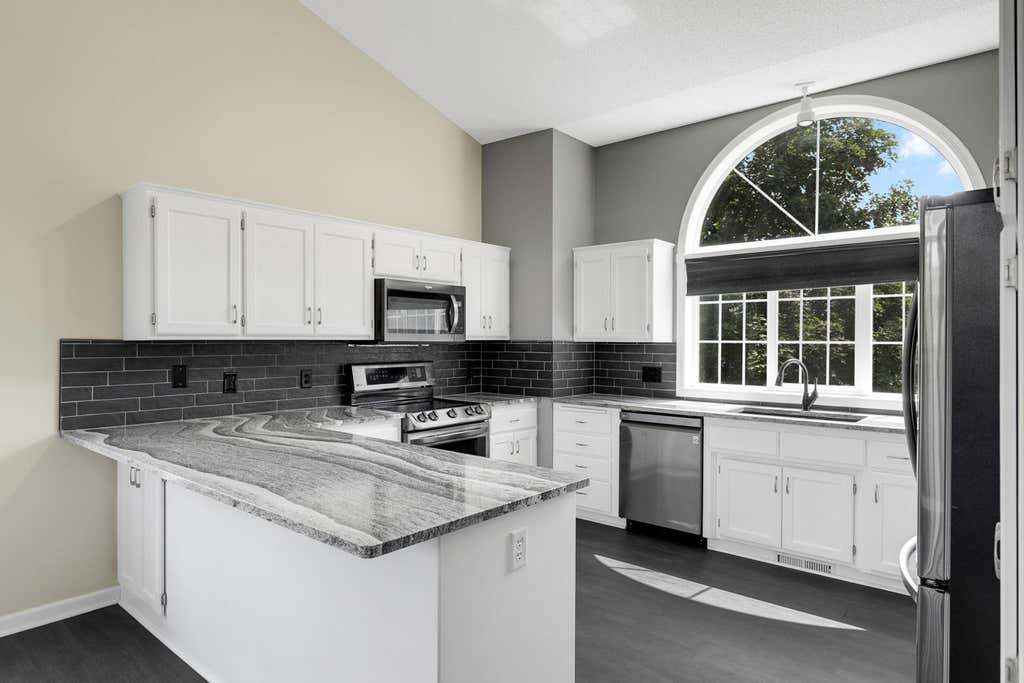 Photo of 725 103rd Avenue NE, Blaine, MN 55434 (MLS # 7121998)