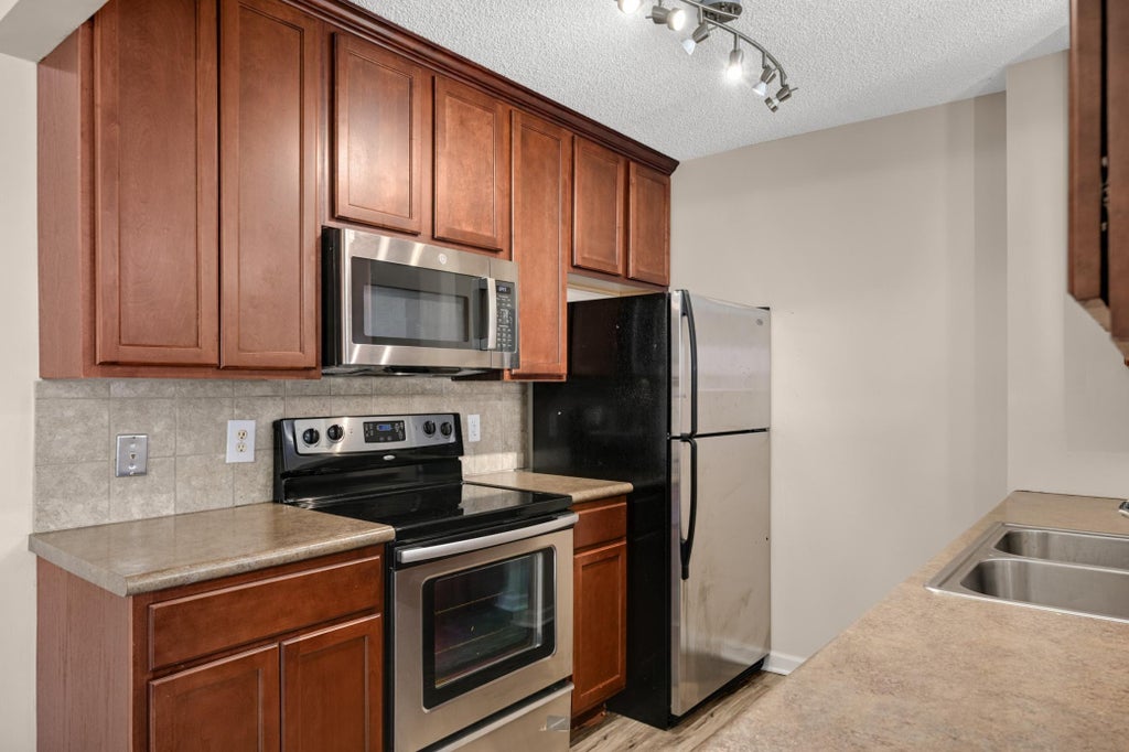 Photo of 1498 Woodview Avenue W, Eagan, MN 55122 (MLS # 7127687)