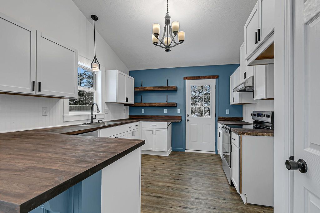 Photo of 1202 Blossom Boulevard NW, Isanti, MN 55040 (MLS # 7000515)