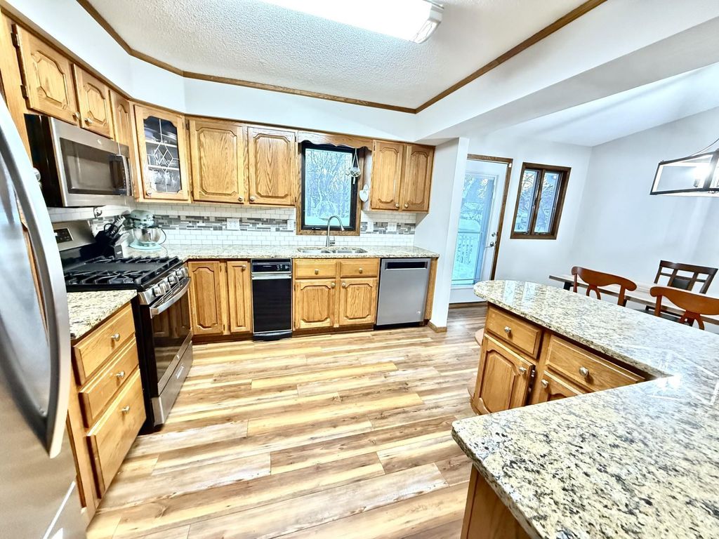 Photo of 424 106th Avenue NW, Coon Rapids, MN 55448 (MLS # 7001926)