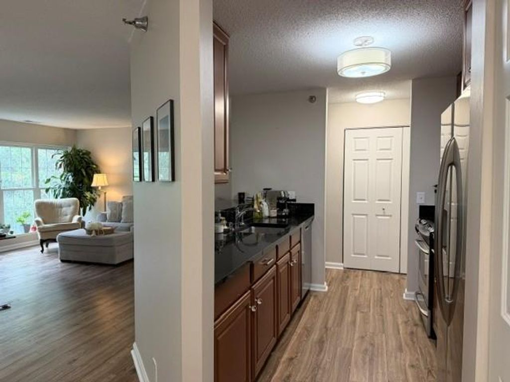 Photo of 6010 Chasewood Parkway #203, Minnetonka, MN 55343 (MLS # 7106289)