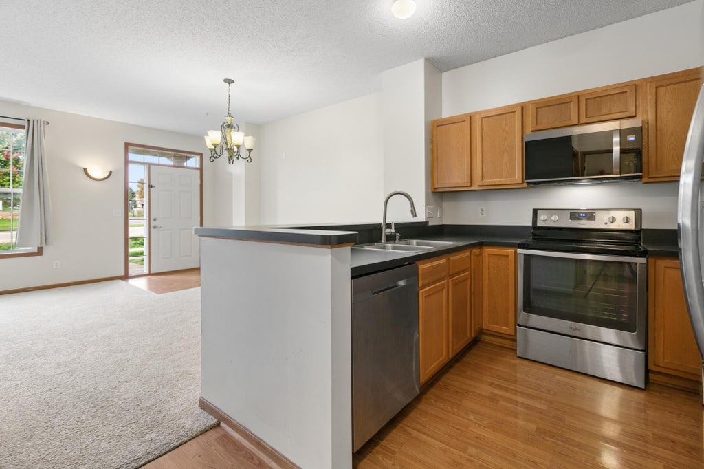 Photo of 7310 Bunker Lake Boulevard NW, Ramsey, MN 55303 (MLS # 7156180)