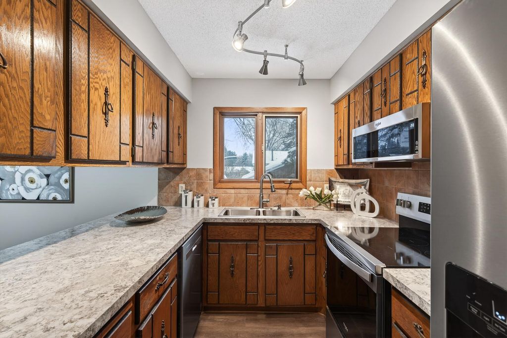 Photo of 10549 Lancaster Lane N, Maple Grove, MN 55369 (MLS # 6826684)