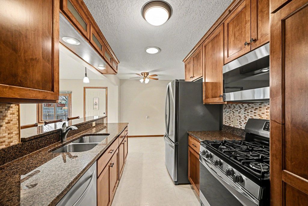 Photo of 220 103rd Avenue NW, Coon Rapids, MN 55448 (MLS # 7036086)