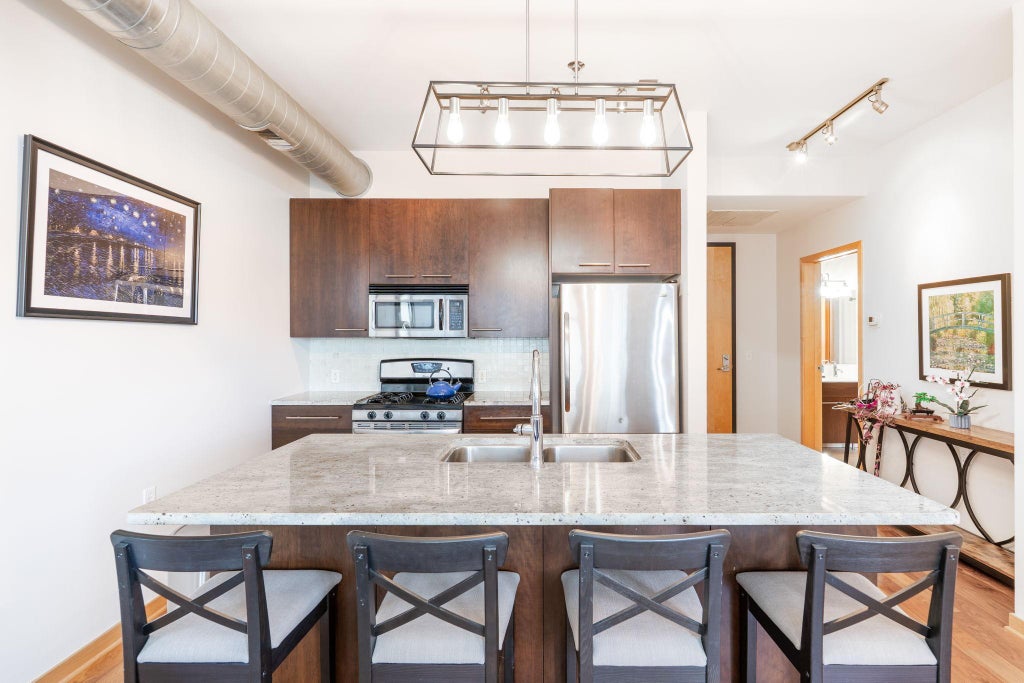 Photo of 1211 Lagoon Avenue #305, Minneapolis, MN 55408 (MLS # 7141341)