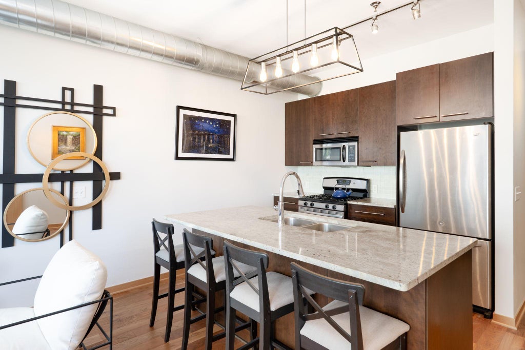 Photo of 1211 Lagoon Avenue #305, Minneapolis, MN 55408 (MLS # 7141341)
